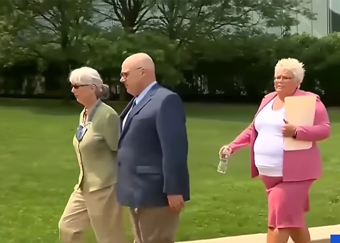 An old couple walking with an individual, representing eBay's massive karma backfiring.