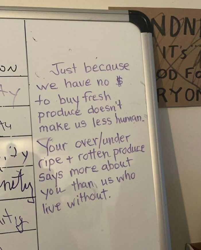 A whiteboard with an outrageous request written about fresh produce and being human.
