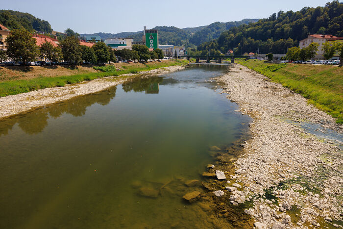 A shallow river with exposed rocky banks, affected by Europe's brutal drought.