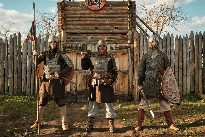 Three men in historical armor, representing Europeans who might be surprised by questions Americans asked.
