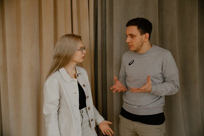A man and woman having a serious discussion, representing Europeans pondering questions from Americans.