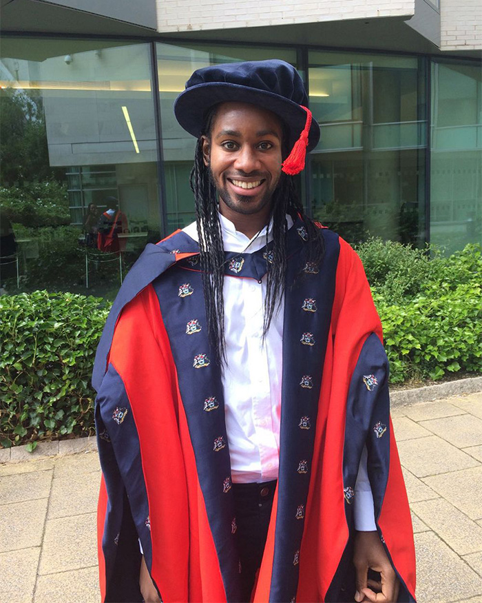 An ex-Cambridge professor in vibrant red and blue academic gown and hat, involved in the PhD plagiarism scandal. An ex-Cambridge professor in vibrant red and blue academic gown and hat, involved in the PhD plagiarism scandal.