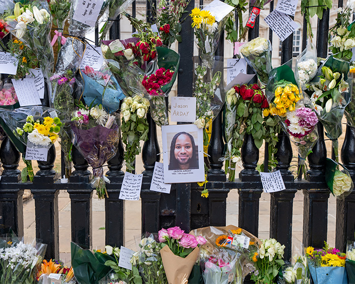 Flowers and notes for Jason Arday, the Cambridge Professor, adorning a gate after his passing. Flowers and notes for Jason Arday, the Cambridge Professor, adorning a gate after his passing.