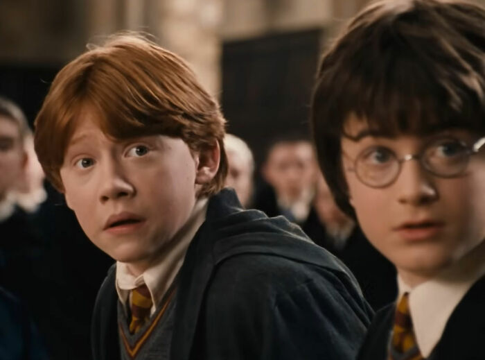 Young Rupert Grint as Ron Weasley alongside Harry Potter, returning to his iconic role. Young Rupert Grint as Ron Weasley alongside Harry Potter, returning to his iconic role.