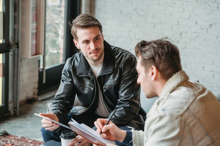 Two men discussing important documents, reflecting on people in their lives they can't respect.
