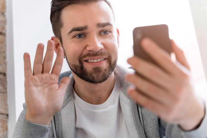 A man on a video call, representing the damaged father-daughter bond due to a paranoid mom. A man on a video call, representing the damaged father-daughter bond due to a paranoid mom.