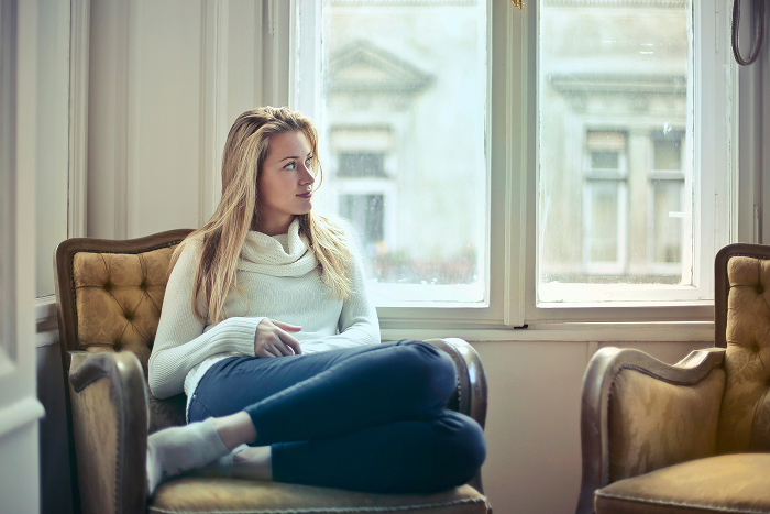 A woman sits thoughtfully by a window, reflecting on a man suggesting an open relationship and his inability to handle it. A woman sits thoughtfully by a window, reflecting on a man suggesting an open relationship and his inability to handle it.