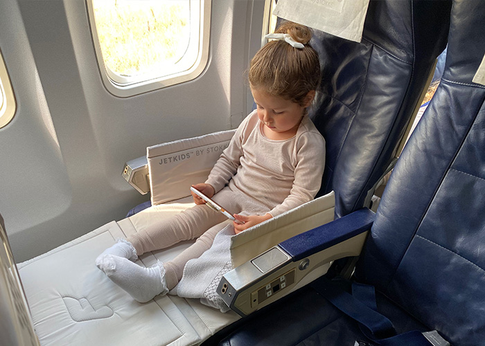 An unruly toddler on a flight, not wearing a seatbelt, potentially causing a flight cancellation. An unruly toddler on a flight, not wearing a seatbelt, potentially causing a flight cancellation.