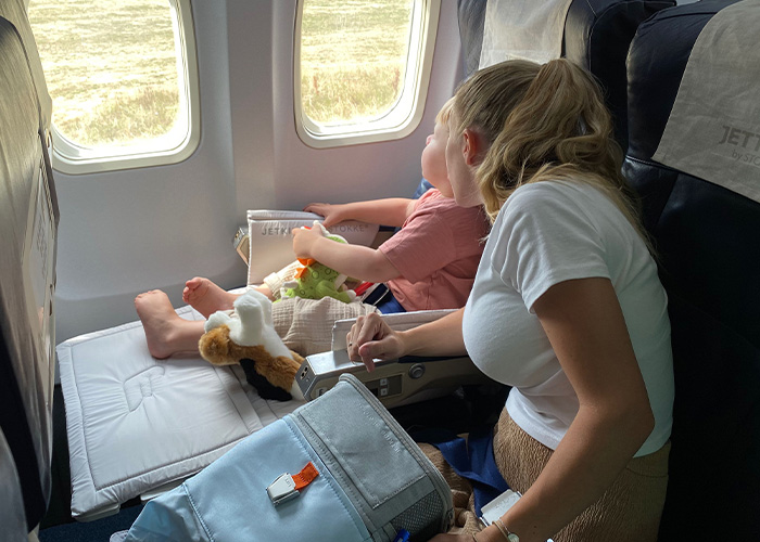 Mother with an unruly toddler on a flight, possibly leading to a flight being canceled and passengers stranded. Mother with an unruly toddler on a flight, possibly leading to a flight being canceled and passengers stranded.
