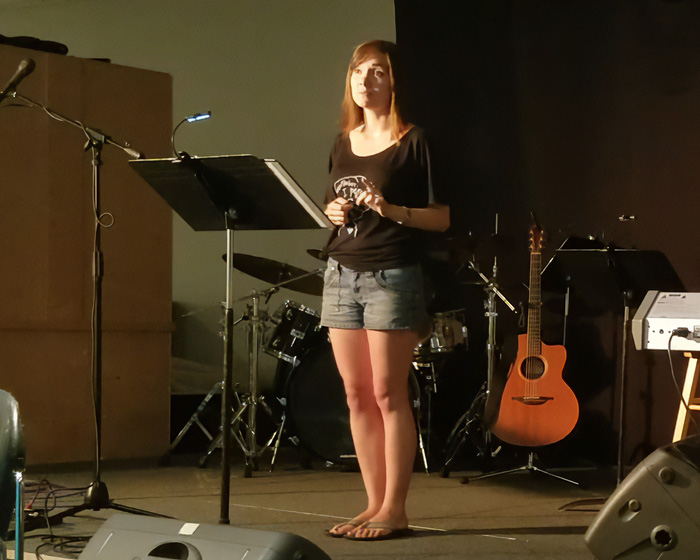 A former pastor turned adult industry worker stands on stage in shorts and a t-shirt, revealing strange requests. A former pastor turned adult industry worker stands on stage in shorts and a t-shirt, revealing strange requests.