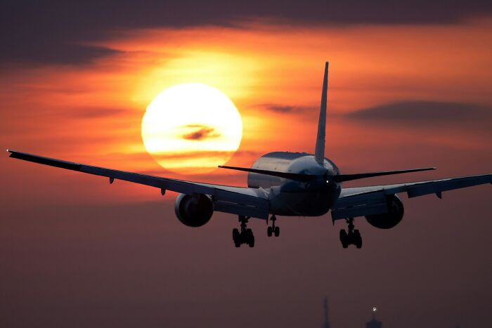 Cabin crew questions: Airplane flying at sunset, connecting to questions asked of cabin crew.