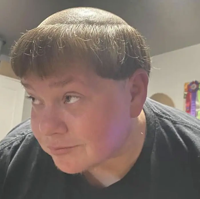 A person with a bowl-cut and shaved sides, displaying one of many bold hairstyles.