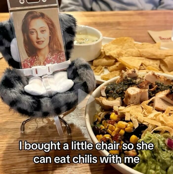 A Serotonin Meme featuring a small chair holding a photo, next to a meal, bringing comfort.