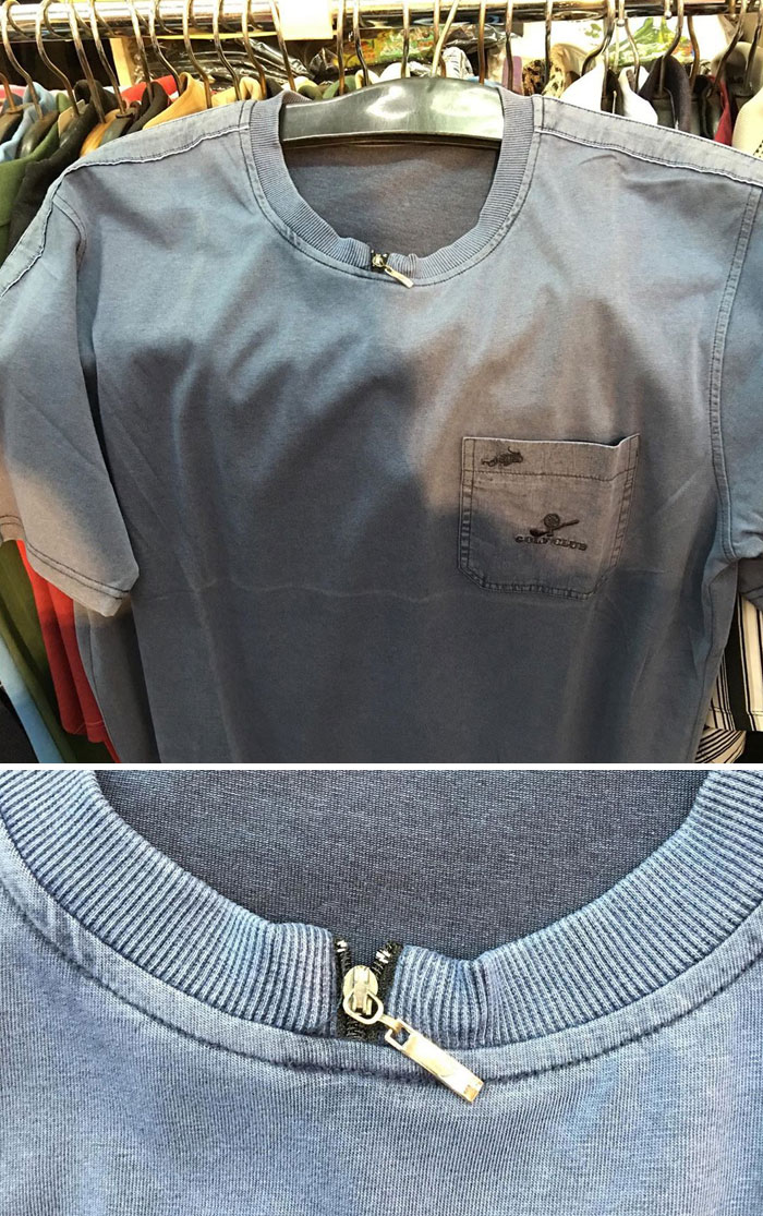 A blue T-shirt with a small, misplaced zipper at the collar, highlighting a hilariously bad fashion crime.
