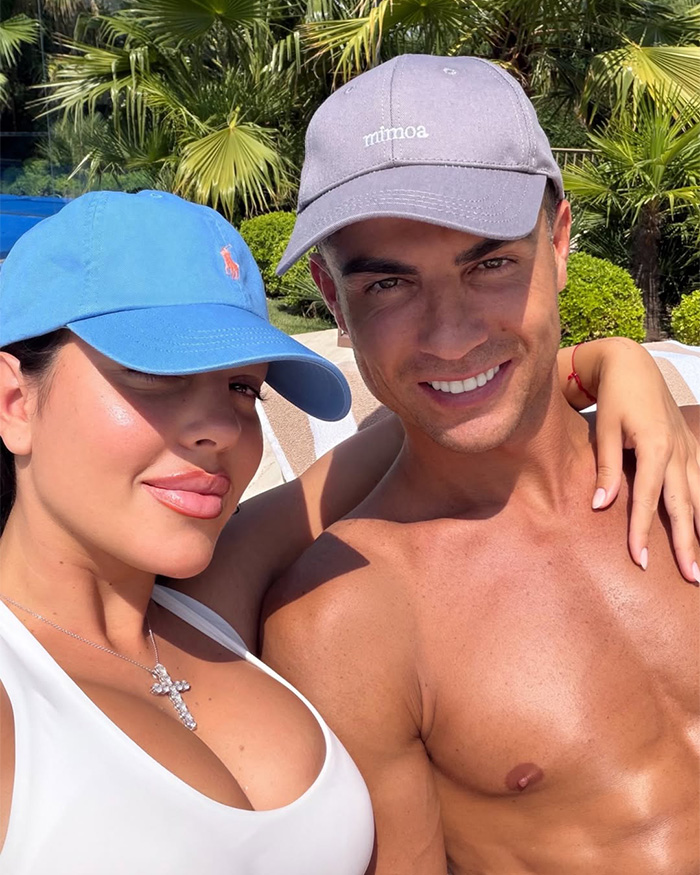 Georgina Rodriguez and Cristiano Ronaldo in caps, smiling together, as she hits back at body-shamers.