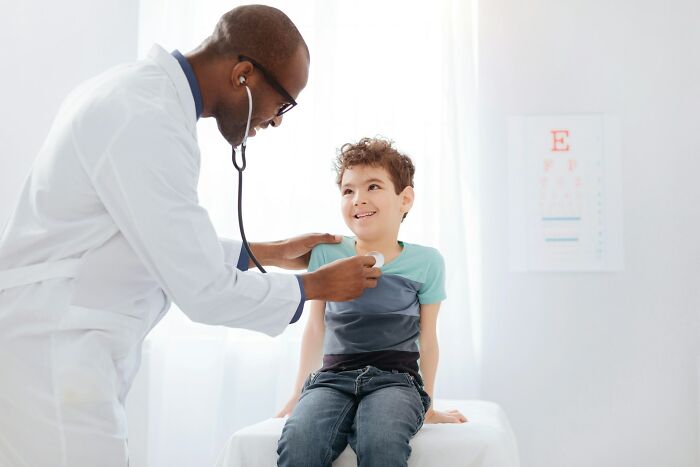 A doctor gives a boy a check-up. Doctors reveal the diagnoses that were the hardest to deliver.