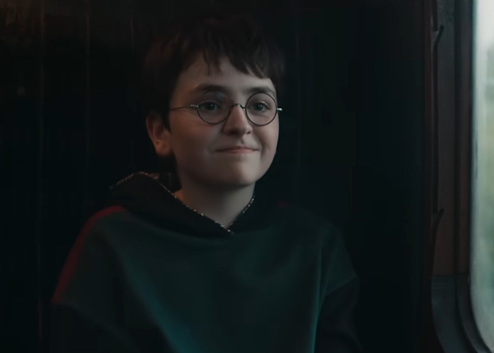 Smiling Harry Potter fan, reflecting on authorities rerouting an undersea cable due to Harry Potter fans.