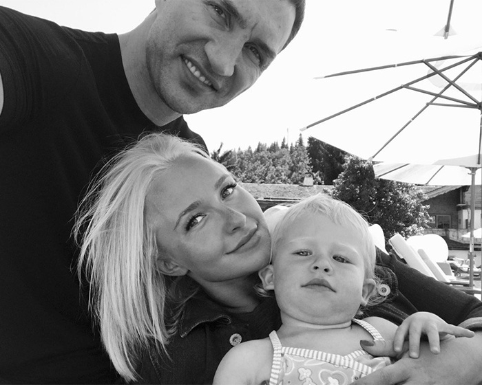 A black and white photo of Hayden Panettiere, her boyfriend, and their daughter together. A black and white photo of Hayden Panettiere, her boyfriend, and their daughter together.