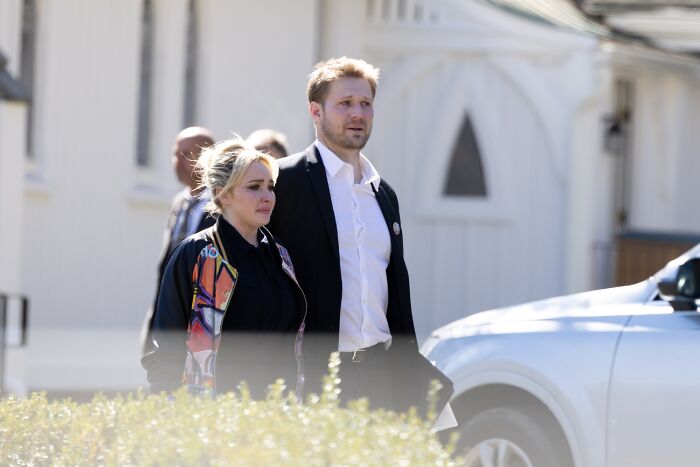 Hayden Panettiere with her boyfriend, walking outdoors.