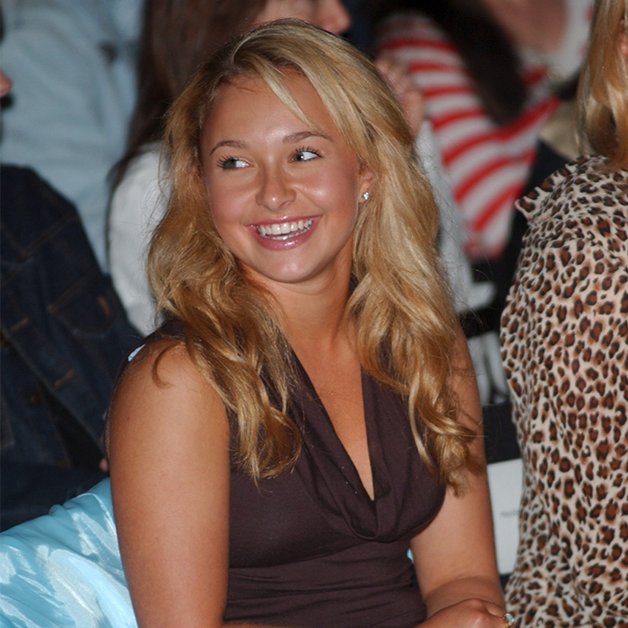 Hayden Panettiere smiling, wearing a brown top, amidst a crowd, sparking a dark theory about her passing. Hayden Panettiere smiling, wearing a brown top, amidst a crowd, sparking a dark theory about her passing.