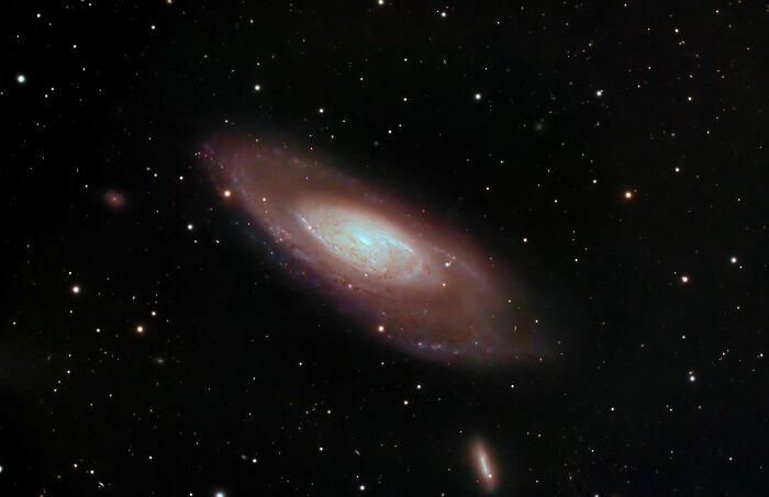 A spiral galaxy surrounded by stars in the vastness of space. Harmless-looking things can be dangerous.