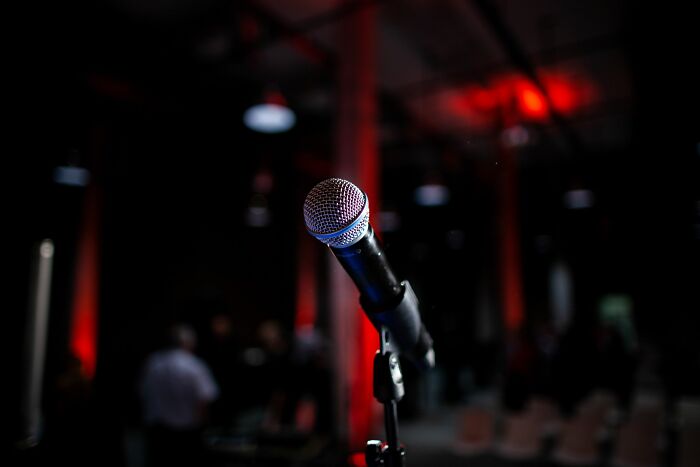 A microphone on a stand, ready for funny encounters and stories from American tourists.