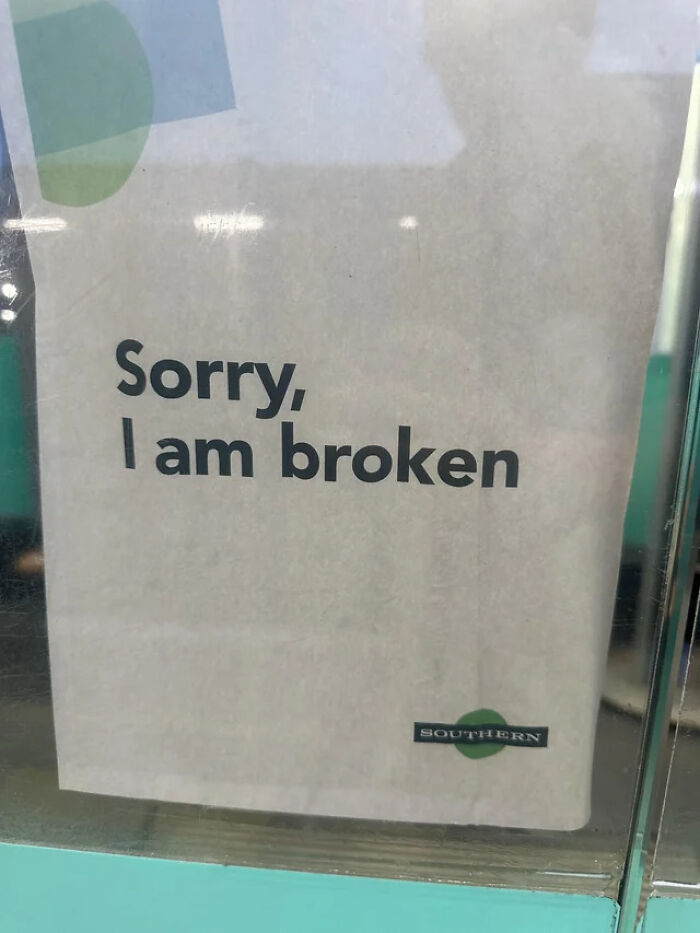 A sign on a train or bus with the words Sorry, I am broken, demonstrating dry British humor.