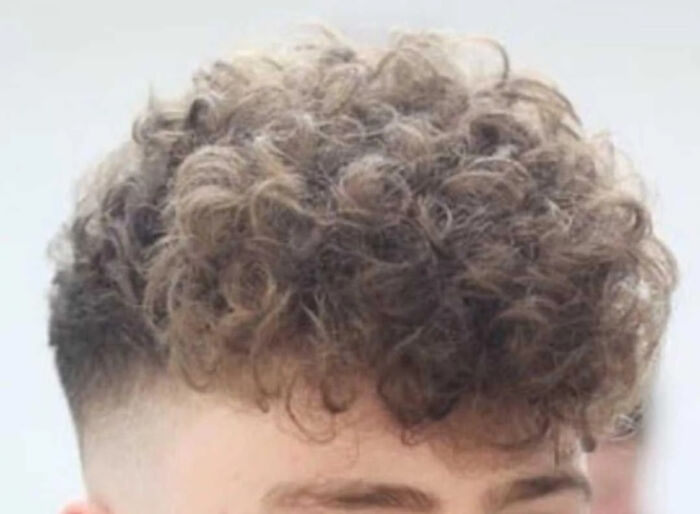 British humor with a person having dry curly hair.