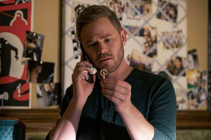 X-Men actor holding a small, ornate object while on the phone, confused about being mistaken for his twin bro. X-Men actor holding a small, ornate object while on the phone, confused about being mistaken for his twin bro.