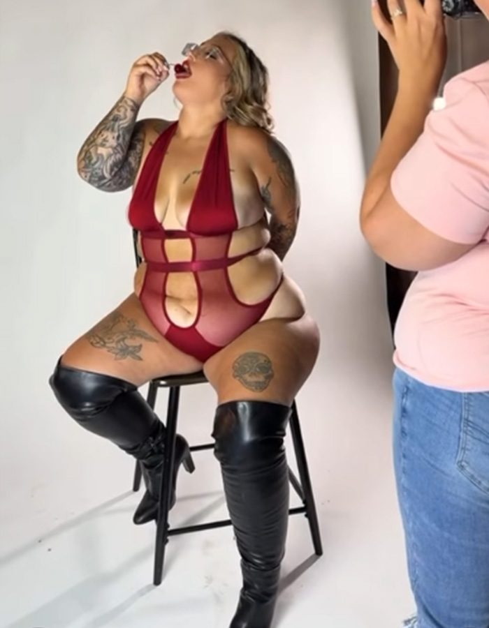 Honey Boo Boo star Pumpkin posing for an adult platform photoshoot in a red bodysuit and thigh-high boots.