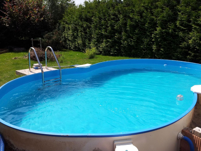 A blue swimming pool in a backyard, showing the pool the brother paid for. A blue swimming pool in a backyard, showing the pool the brother paid for.