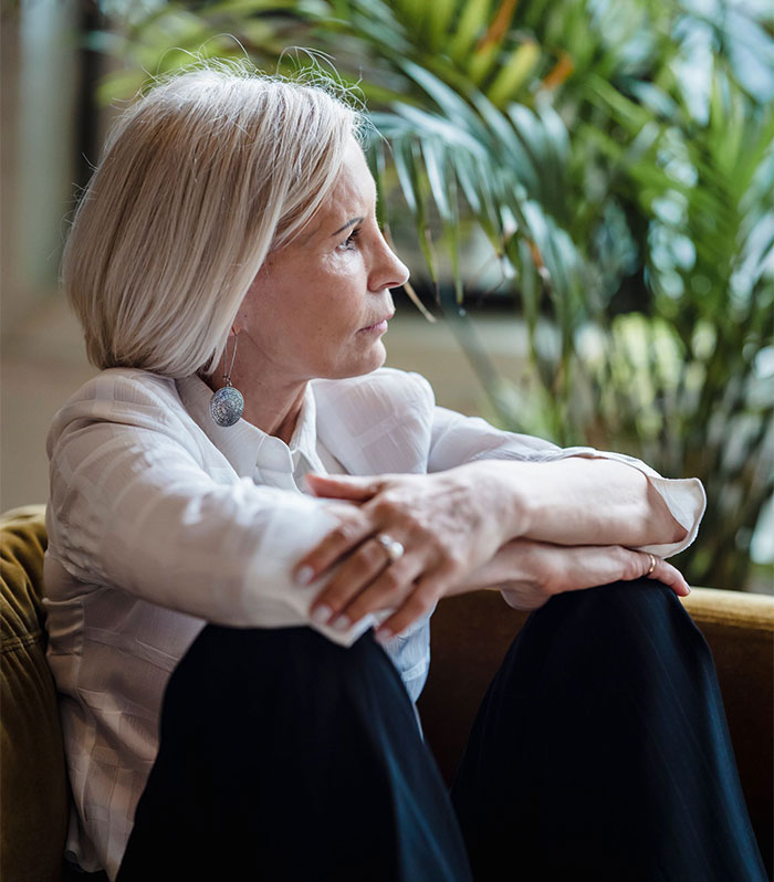 Woman looking distressed, reflecting on the worst timing possible to apologize for stealing a husband. Woman looking distressed, reflecting on the worst timing possible to apologize for stealing a husband.
