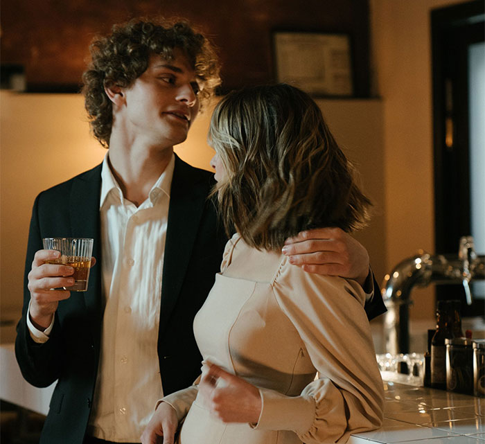 A couple at a bar, possibly representing the husband and the woman who stole him, with worst apology timing. A couple at a bar, possibly representing the husband and the woman who stole him, with worst apology timing.