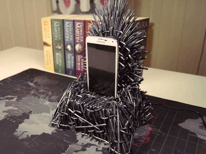 A custom phone holder shaped like the Iron Throne, a unique DIY home project demonstrating creativity.