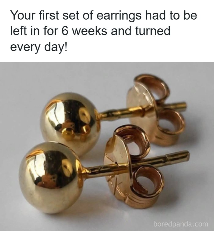 A pair of small, golden stud earrings, symbolizing a common experience from the '80s and how old you become.