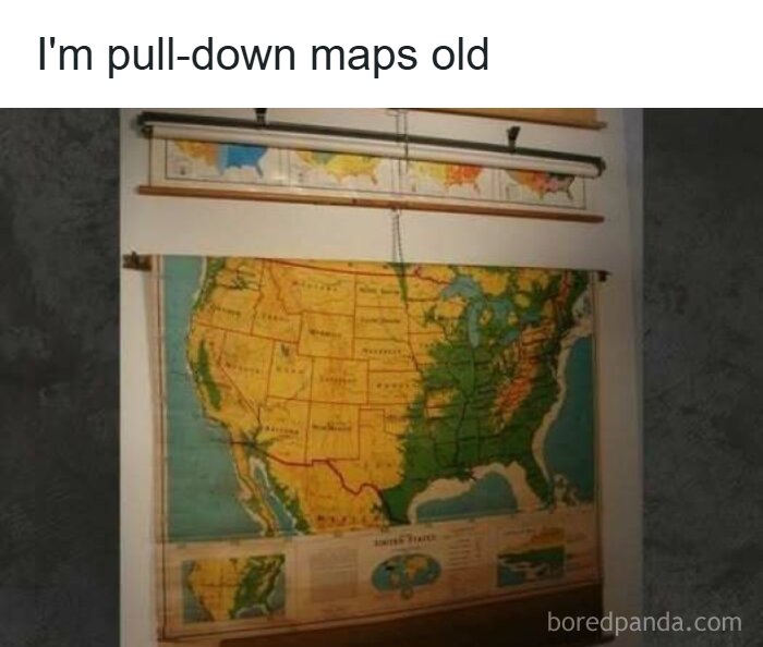 A classroom with several pull-down maps of the USA, reminding viewers of the good old days of the '80s.