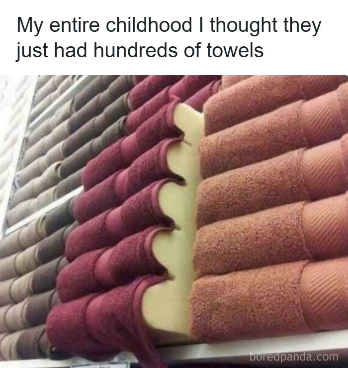 A retail display of stacked towels revealing a foam insert for volume, a fascinating find showing merchandising tricks.