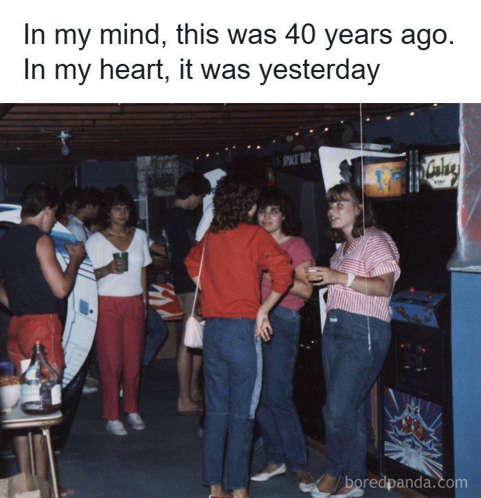 A group of young people gathered in an arcade, enjoying the good time and reminding of the 80s.