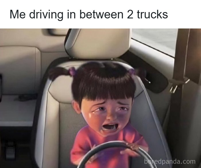A meme queen crying while driving in between two trucks, looking scared.