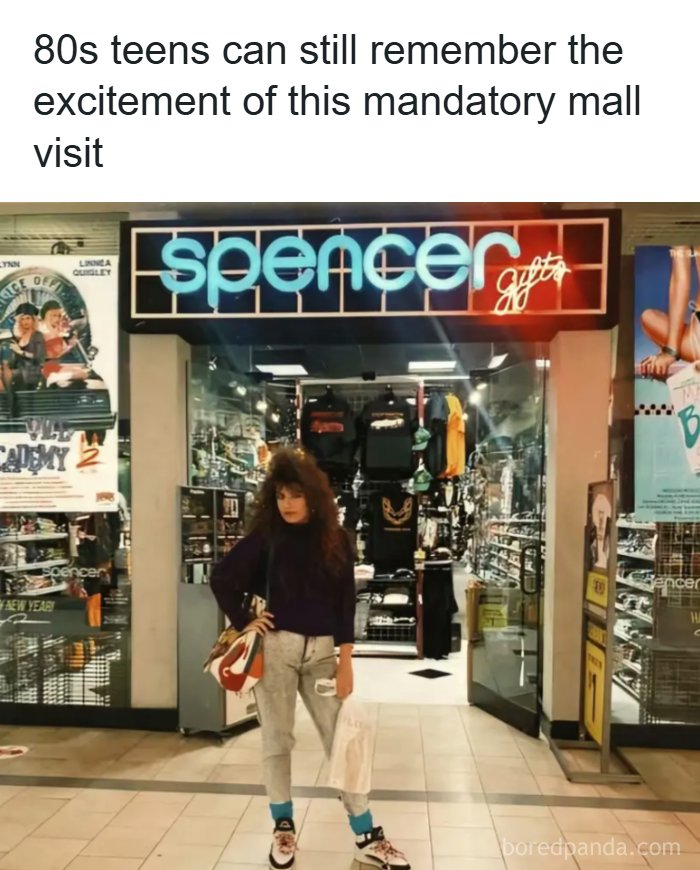 A teen in 80s fashion poses outside Spencer's Gifts, a mandatory mall visit from the good times of the 80s.