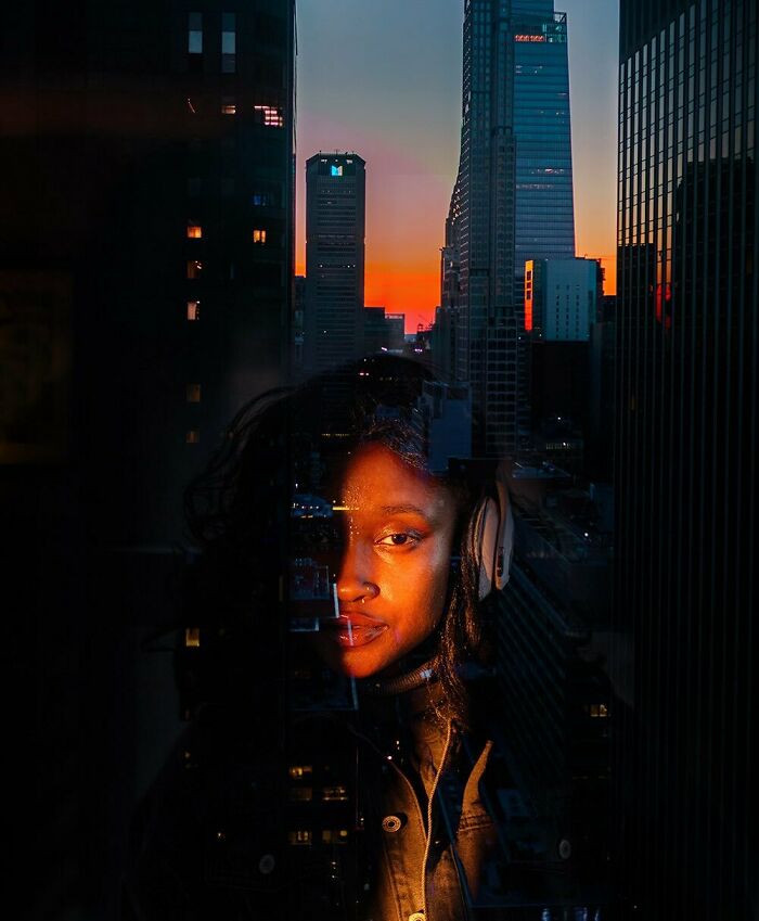 Oliver Takáč cinematic portrait, a woman with headphones against a vibrant sunset city skyline reflection.