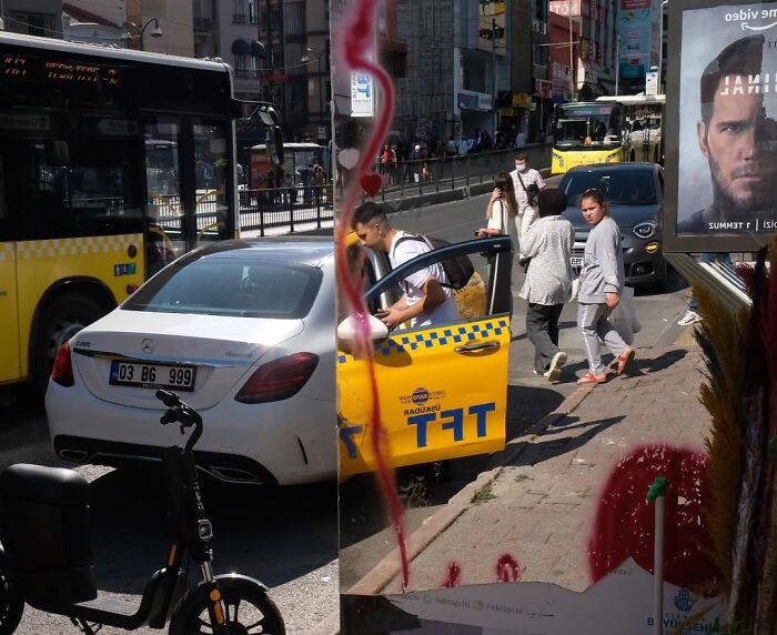 A candid moment from the streets: a man exits a yellow taxi on a busy street with pedestrians and vehicles.