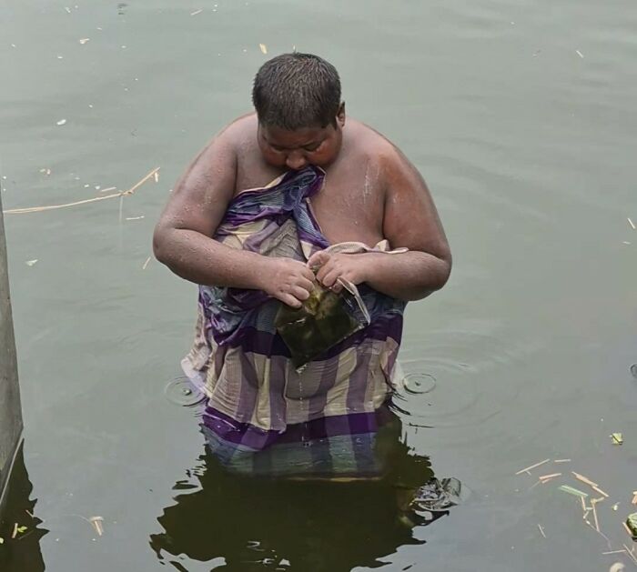 Teen spending years in a pond due to a mysterious condition, trying to open a container while submerged.