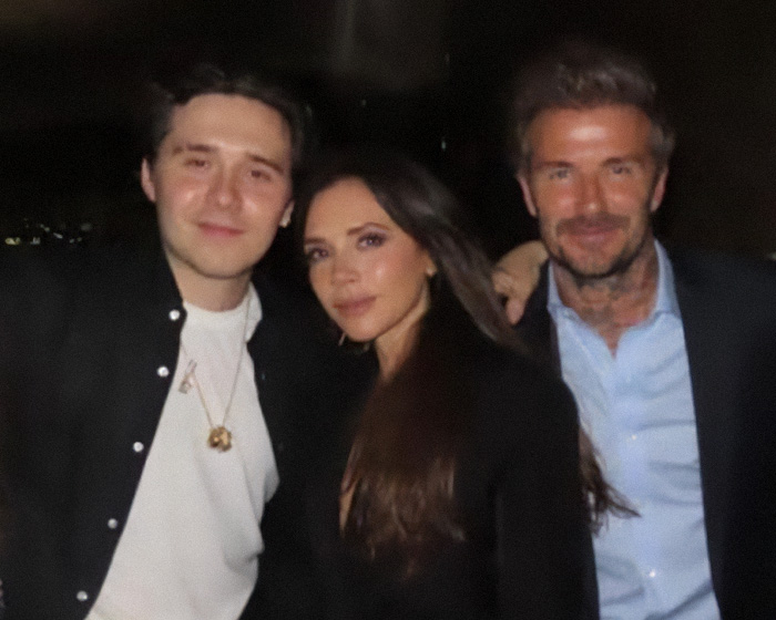 A joyous photo of the Beckhams family, David, Victoria, and Brooklyn, at a wedding. A joyous photo of the Beckhams family, David, Victoria, and Brooklyn, at a wedding.