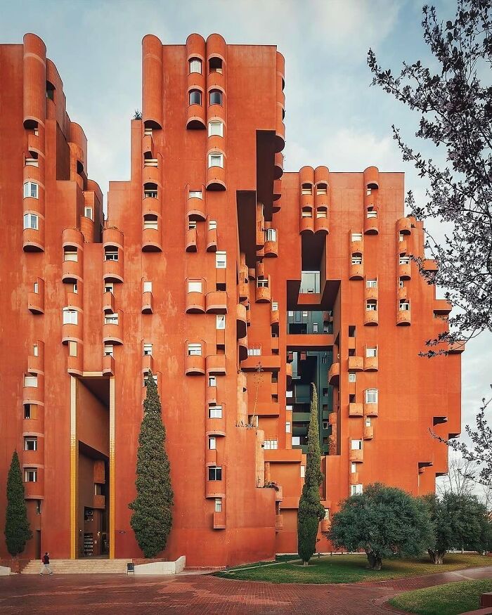 Brilliant and beautiful designs, a unique terraced apartment building with cylindrical balconies, showcasing innovative architecture.
