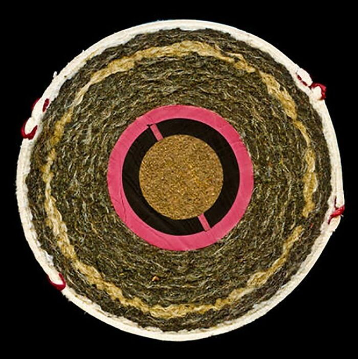 An interesting photo of an object cut in half: a cross-section of a golf ball showing its layered internal structure.