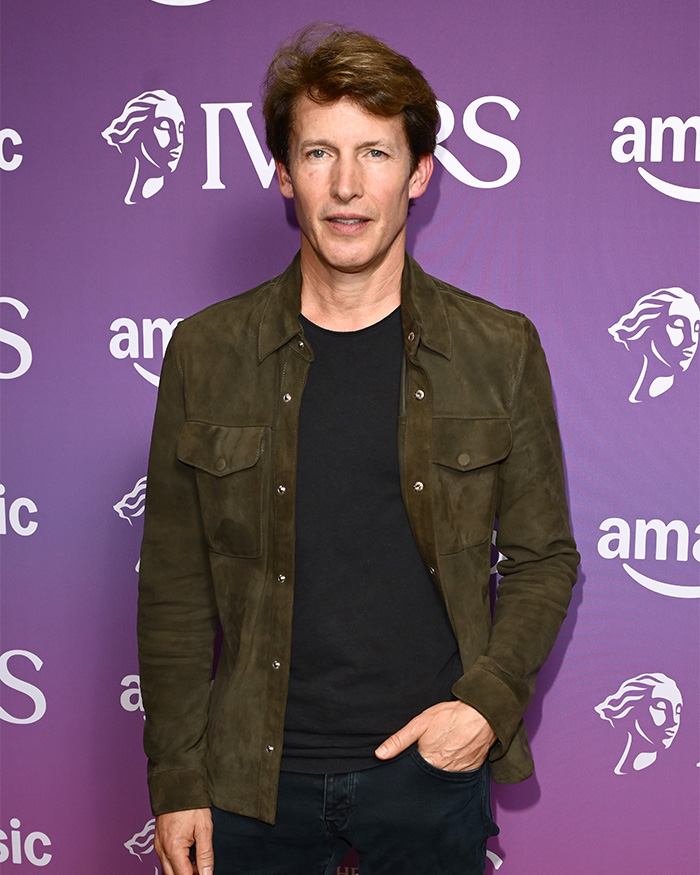 Singer James Blunt posing for a photo on a purple background with IVORS and Amazon Music logos. Singer James Blunt posing for a photo on a purple background with IVORS and Amazon Music logos.