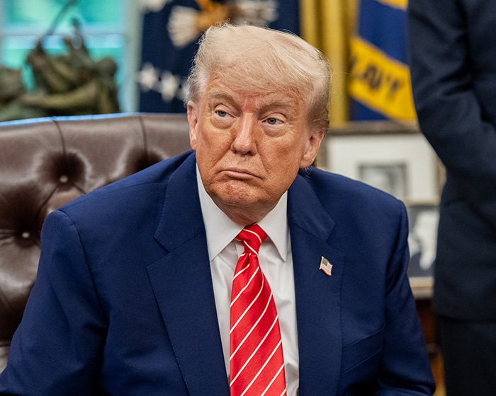 Donald Trump sitting in a chair, appearing pensive, with JD Vance's newborn son as a topic of discussion. Donald Trump sitting in a chair, appearing pensive, with JD Vance's newborn son as a topic of discussion.