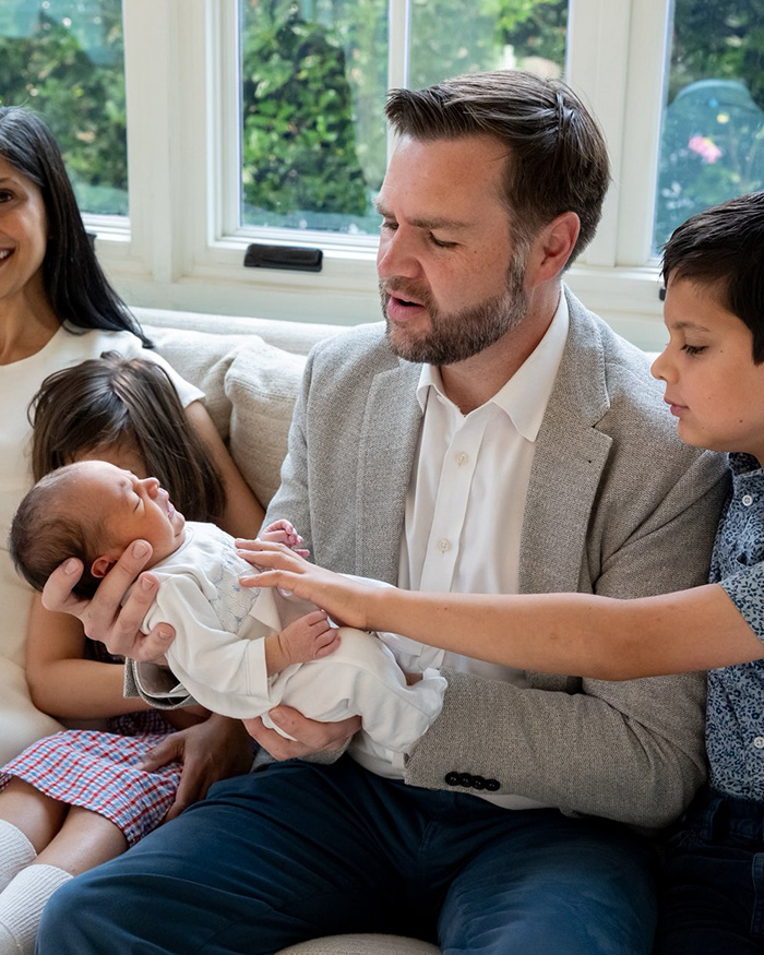 JD Vance holding his newborn son with his family, sparking casual comment and critical observations. JD Vance holding his newborn son with his family, sparking casual comment and critical observations.