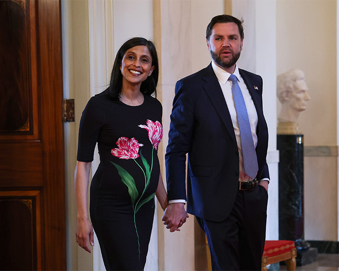 JD Vance and his wife, Usha Vance, hold hands and smile, walking together, with JD Vance's newborn son in mind. JD Vance and his wife, Usha Vance, hold hands and smile, walking together, with JD Vance's newborn son in mind.